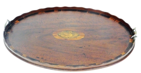 A 19thC mahogany Sheraton design oval serving tray, the centre with marquetry navette of a swan, (AF), 77cm x 53cm.