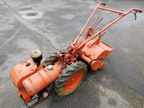 A Merry Tiller type agricultural rotorvator, model 6-3, in orange.