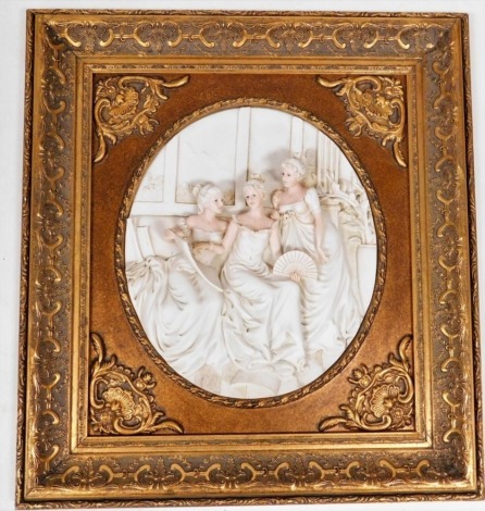A composite oval plaque depicting three figures of females reading, in a gilt painted plaque with academy label to reverse, 60cm x 54cm.