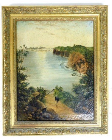 19thC School. Coastal scene with figure on a wooded path leading to the sea, oil on canvas, 41cm x 31cm, in ornate frame.