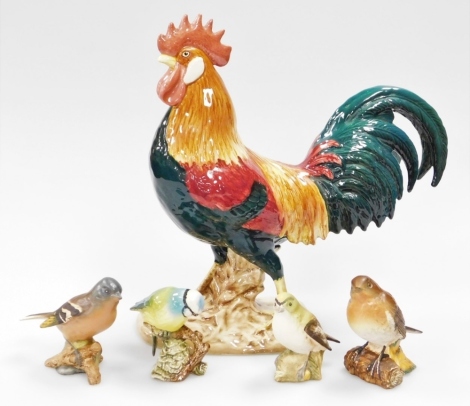 A Beswick pottery figure of Leghorn, model number 1892 and four small bird ornaments. (5)