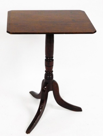 A George III mahogany side table, with canted snap top, baluster pillar and tripod base, 68cm high, 51cm wide, 38cm deep.