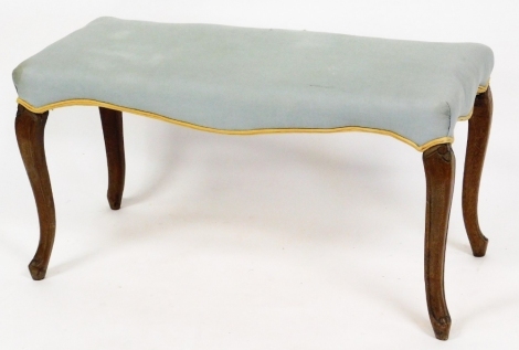 A Victorian walnut duet stool, with later upholstered turquoise top, on French cabriole legs, 46cm high, 88cm wide, 38cm deep.