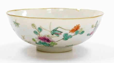 A Chinese porcelain bowl, enamelled with a grasshopper on flowering plants, four character mark to base, 16cm diameter. (AF)