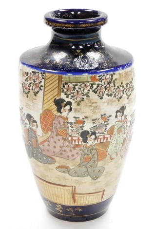 A large Japanese blue ground Satsuma vase, painted with panels of geisha in a garden, and figures in a mountainous landscape, gilt floral details to the borders, late Meiji period, 32cm high.