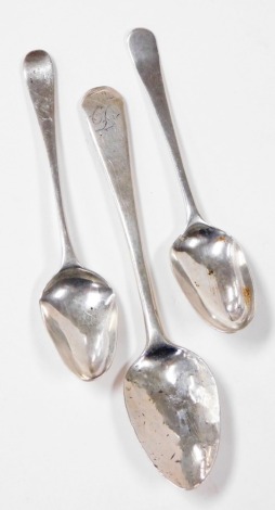 Three various silver teaspoons, each with initialled top, one stamped D, one C, the other CH?, George V and later, 1oz. (AF)