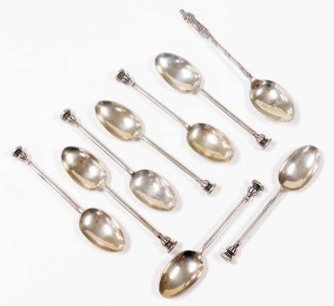 Eight George V silver teaspoons, comprising two sets of four, each with seal tops bearing the initials FGC, four Sheffield 1934 and four Sheffield 1937, together with a silver teaspoon with religious figure to top and inscribed to the bowl C.G.C 1930, Bir