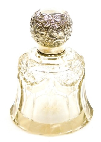 A George V silver and pressed glass dressing table jar, the silver top with embossed floral detailing, London 1910, 13cm high. (AF)