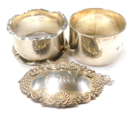A collection of small silver, Port decanter label and two napkin rings, 2¼oz overall. (3)