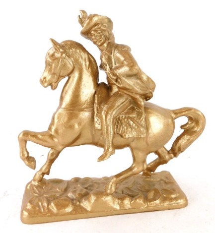 A spelter figure of a gentleman riding a horse in cowboy style, rectangular base, later painted, 15cm high.