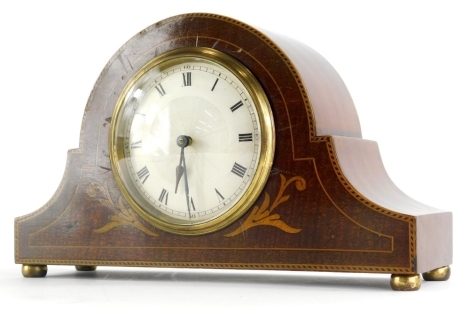 An Edwardian mahogany Napoleon hat mantel clock, the shaped case with a boxwood stringing and a 9cm diameter, Roman numeric Arabic dial, on compressed metal bun feet, with French key wind movement, numbered 37196, 16cm high.