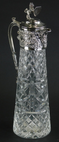 A 20thC silver plated and cut glass claret jug, with a lion and shield finial, floral scroll handle and Bacchus spout, 33cm high.