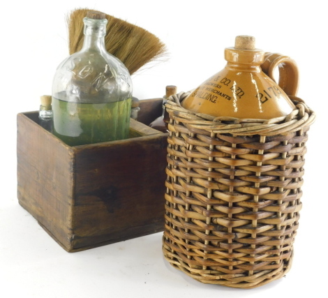 An early 20thC Soames and Co of Spalding stoneware two coloured flagon, in wicker casing, 41cm high, various other pharmaceutical style bottles, a two sectional Provincial Dairies box containing pharmaceutical bottles, large double headed brush, etc. (a q