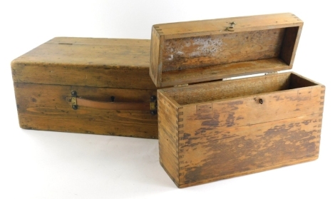 An early 20thC pine box, of rectangular form with hinged lid and plain interior, with leather strap and key, 18cm high, 52cm wide, 25cm deep, and a further rectangular wooden card box.