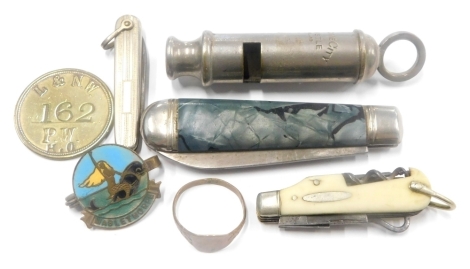 An Acme chrome plated whistle, of cylindrical form with hook top, 8cm high, three miniature pen knives, an enamel Mablethorpe badge, L&NW 162PWHO token, and a dress ring (a quantity).