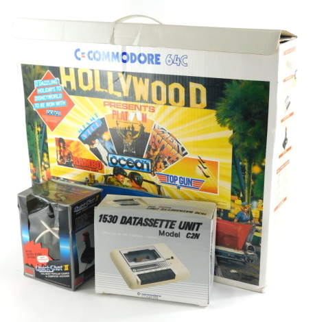 A vintage Commodore C64 boxed Hollywood set of boxed joystick, user manual, units, wires, etc., the outer box 60cm wide.