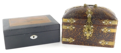 A pressed leather casket, of domed form with swing brass handle and brass mounts, with elaborate escutcheon and plain interior, 19cm high, 23cm wide, 14cm deep, and a pressed leather jewellery box, English make stamped locks and mother of pearl escutcheon