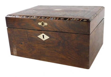 A Victorian and later rosewood and burr walnut workbox, the hinged lid inlaid in pewter, mother of pearl, etc., with marquetry motifs, enclosing a vacant interior, 28cm wide.