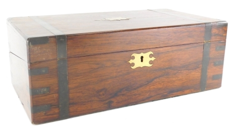 A 19thC and later rosewood campaign style writing box, of rectangular form with visible dovetails, the hinged lid revealing a tooled leather writing section with space for inkwells and pens, 16cm high, 45cm wide, 23cm deep.