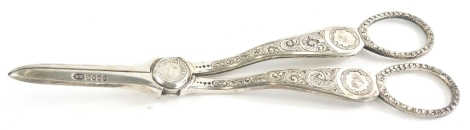 A pair of early 20thC silver plated grape scissors, heavily cut with elaborate handles and plain blades, 18cm long.