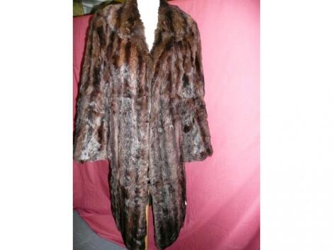 A dark brown vintage fur coat - some wear