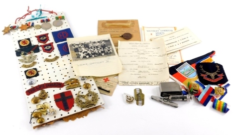 A quantity of medals and ephemera relating to a Sgt Clawson (4867414) of The Seaforth Highlanders, to include his medals, some cap badges, ephemera to include football medal, programme for the 1945 Infantry Brigade Highland Games, a sheet for The Northern