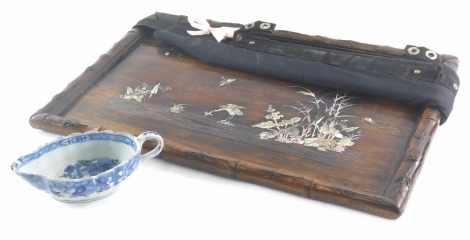 A Chinese hardwood and mother of pearl inlaid tray or plaque, decorated with flowers, leaves and a crane, and a 19thC Chinese export porcelain sauce boat (AF).