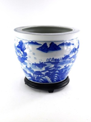 A Chinese porcelain jardiniere, decorated with buildings, mountains, coastline, etc., 34cm diameter.