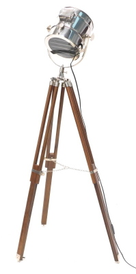 A hardwood and chrome floor lamp, modelled in the form of a cinema lamp.