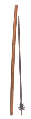 A turned hardwood curtain pole with rings, 250cm long, and a red painted metal curtain pole, 132cm long.