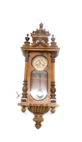 A Vienna type walnut wall clock, with part paper dial, 100cm overall.