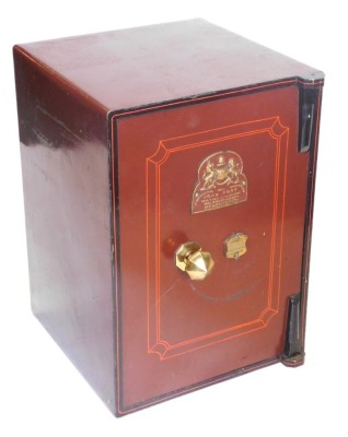 A John Port Manchester small cast iron safe, painted in red and black, 62cm high, 43cm wide.