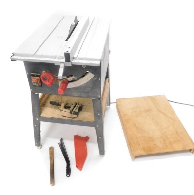 A mains powered table saw, with some accessories.