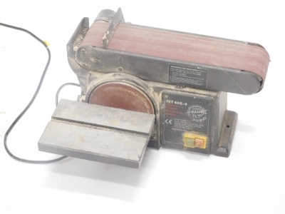 An electric bench mounted belt sander.