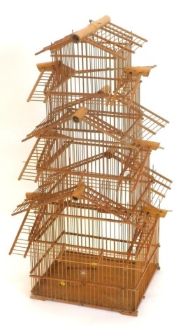 A Oriental bamboo bird cage, of pagoda form, 86cm high.