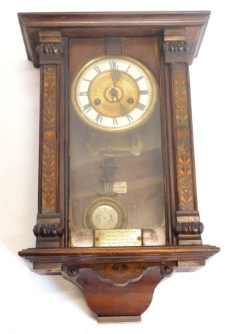 A late 19th/early 20thC Vienna type wall clock, in a walnut case with stencilled decoration, retailer's label for Davis of Nailsworth and presentation plaque to a Miss M Venn by the choir and friends of Forest Green on the occasion of her marriage 1915, 5