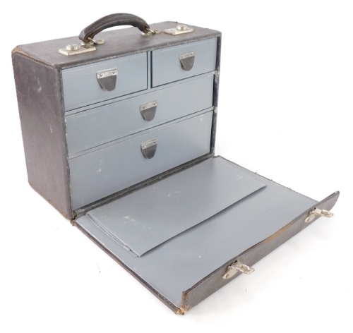 A unusual leather travelling tool or instrument case, the hinged lid enclosing two short and two long drawers with plated mounts.