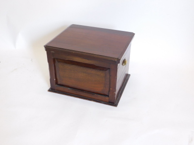 A Victorian walnut box commode, the hinged lid enclosing hinged arm rests, a recess, etc., above a panel front with brass side handles, 52cm wide. - 2