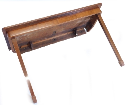 A mahogany folding table, the rectangular crossbanded top above a plain frieze on two hinged square tapering legs to the front and two removable legs to the reverse, 19thC but adapted, 124cm wide, 51cm deep, (AF).