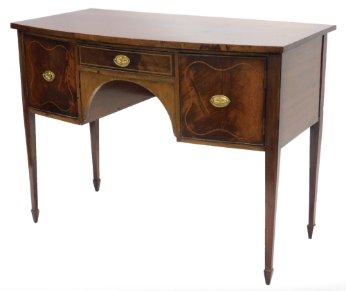 A 19thC mahogany and chequer banded bowfronted small sideboard, with a frieze drawer flanked by two doors, on square tapering legs, 110cm wide.