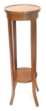 An Edwardian mahogany and boxwood strung two tier plant stand, on splayed legs, 95cm high.