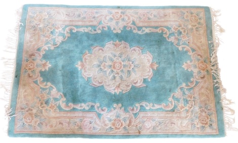 A Chinese rug, with a green ground, decorated in Aubusson style, 180cm x 120cm.