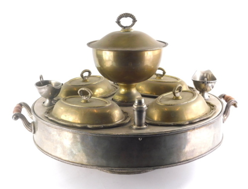 A 20thC silver plated hot plate stand, of circular form, centred by a removable bowl, with four entree dishes, two sauce boats and two pepper pots on a circular foot, with turned handles beaded outline and internal water heater, 74cm wide.