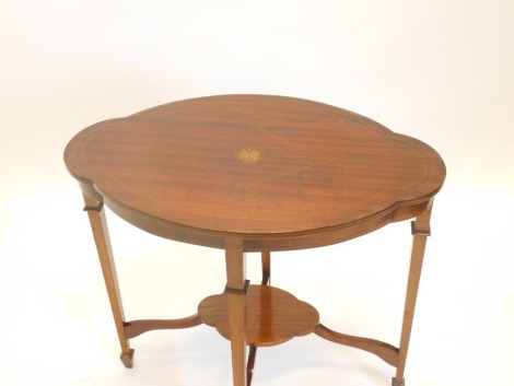 An Edwardian mahogany boxwood and chequer banded window table, the lobed top on square tapering legs with under tier, 76cm wide.