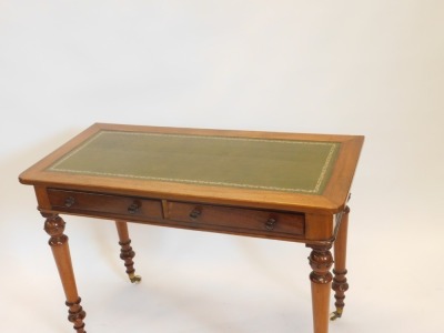 A Victorian mahogany writing table, the rectangular top with a later green leather insert, above two frieze drawers on turned tapering legs with ceramic castors, 108cm wide. - 2