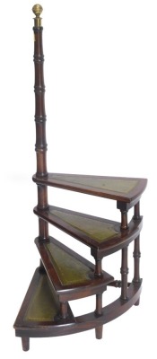 A set of mahogany three tread library steps, with turned supports and brass finial.