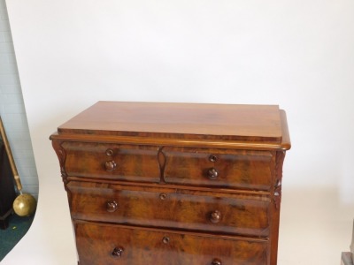 A 19thC continental figured mahogany chest of drawers, with two short and three long drawers, each with shaped fronts and turned handles on short cabriole feet, 99cm wide. - 2