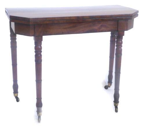 A 19thC mahogany card table, the rectangular top with canted front corners above a plain frieze with ebony stringing on turned tapering legs with castors, (AF), 89cm wide.