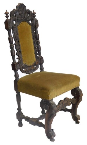 A Victorian ebonised oak side chair, with a padded back and seat on scroll carved legs. (AF)