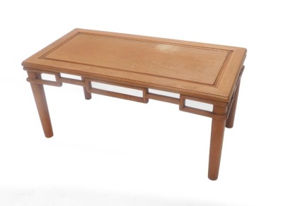A Chinese hardwood rectangular coffee table, with a pierced frieze and turned tapering legs, 91cm wide.
